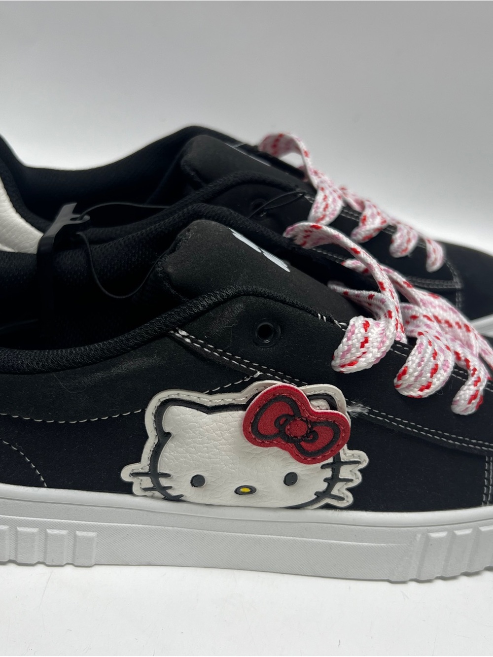 Hello Kitty Black Sneakers with White Sole and Red Bow Accents